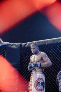 MMA fighter against the cage during a Fight Island Championship match in Mallorca